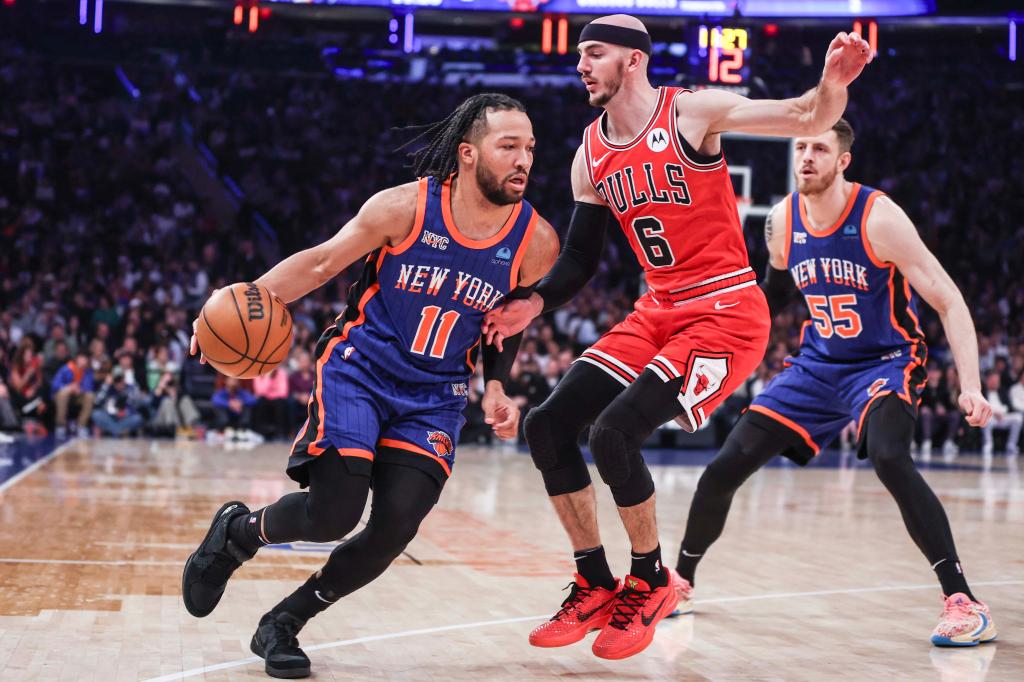 New York Knicks guard Jalen Brunson (11) drives past  Chicago Bulls guard Alex Caruso (6) in the first quarter at Madison Square Garden on April 14, 2024.