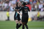 Gotham FC forward Crystal Dunn (19) celebrates with midfielder Rose Lavelle (16) after scoring a goal against Angel City FC during the first half at Red Bull Arena.