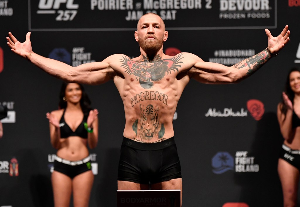 Conor McGregor of Ireland poses on the scale during the UFC 257 weigh-in at Etihad Arena on UFC Fight Island on January 22, 2021 in Abu Dhabi, United Arab Emirates. 