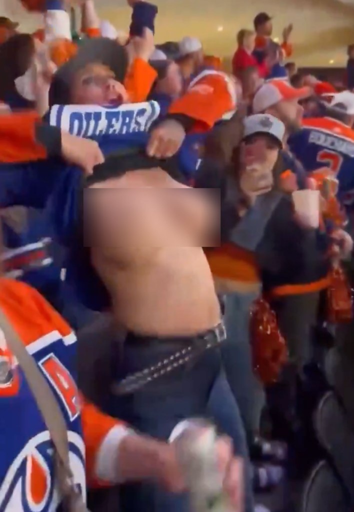 Oilers fan flashes her chest during the Western Conference Final series against the Dallas Stars in Edmonton on May 31, 2024. 