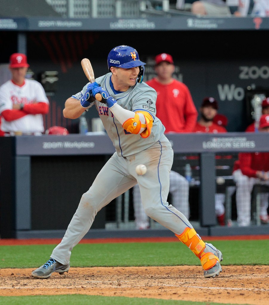 Pete Alonso is hit by a pitch with the bases loaded, driving in a run during the ninth inning vs. the Phillies on June 9, 2024.