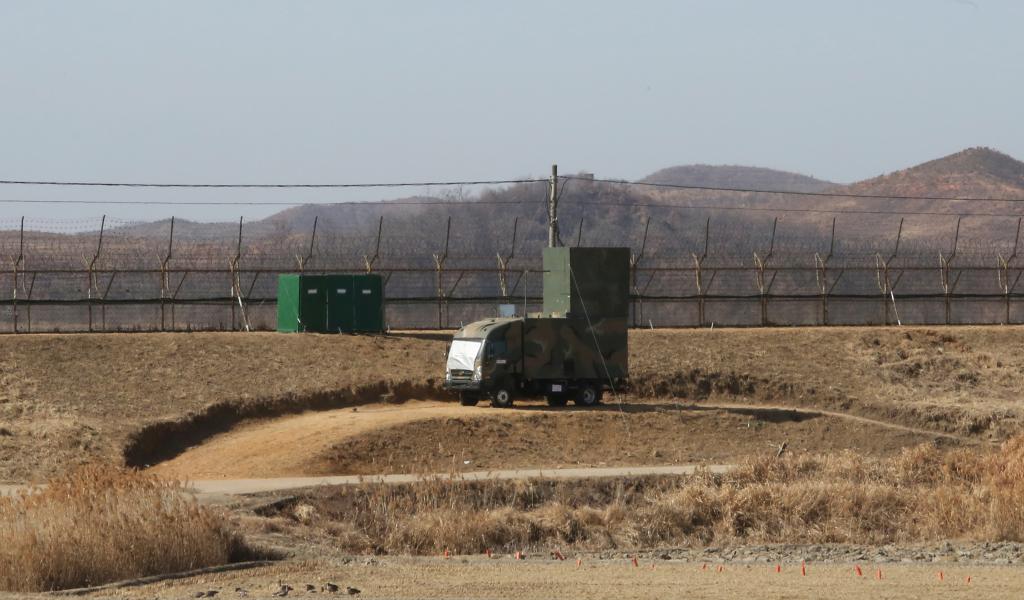 A South Korean military vehicle with loudspeakers is seen in front of the barbed-wire fence in Paju, near the border with North Korea, on Feb. 15, 2018. 