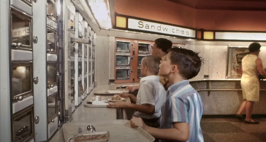 A scene from Lisa Hurwitz's 2021 documentary “The Automat” shows customers eyeing up food offerings.
