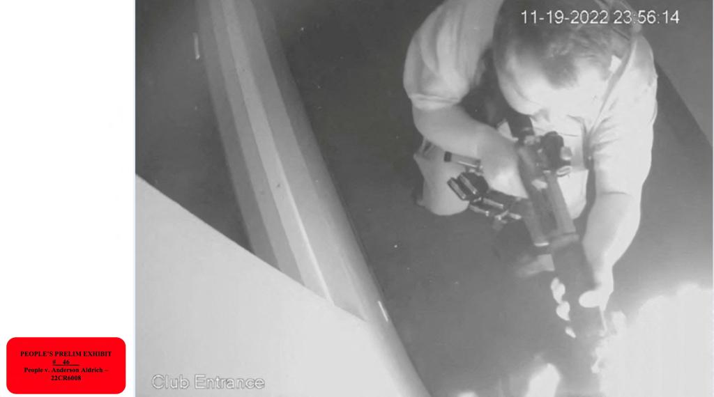 Overhead surveillance camera image of Anderson Lee Aldrich firing a weapon inside Club Q LGBTQ nightclub in Colorado Springs, November 19, 2022