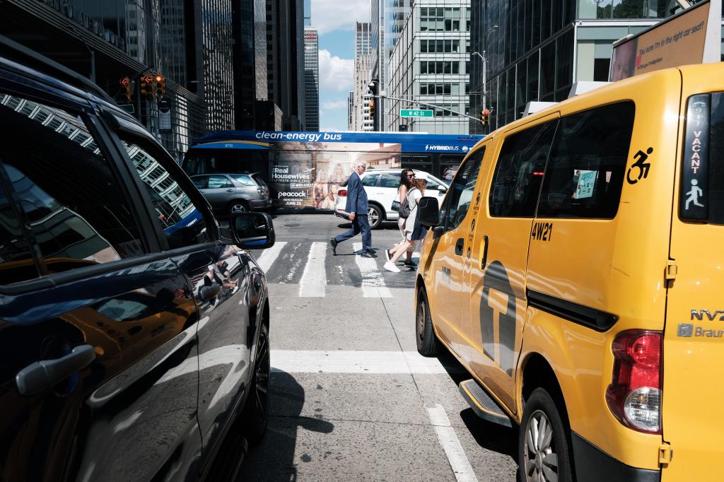 Cars and taxis are held up in Manhattan traffic.