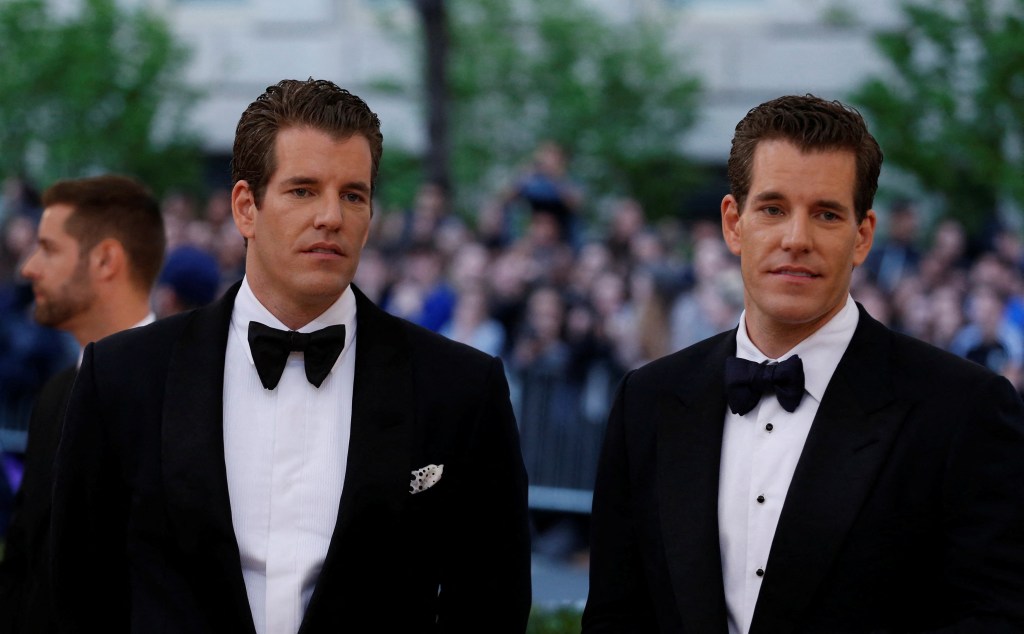 Entrepreneurs Tyler and Cameron Winklevoss in suits and bow ties arriving at the Met Gala, celebrating the opening of 'Manus x Machina: Fashion in an Age of Technology'
