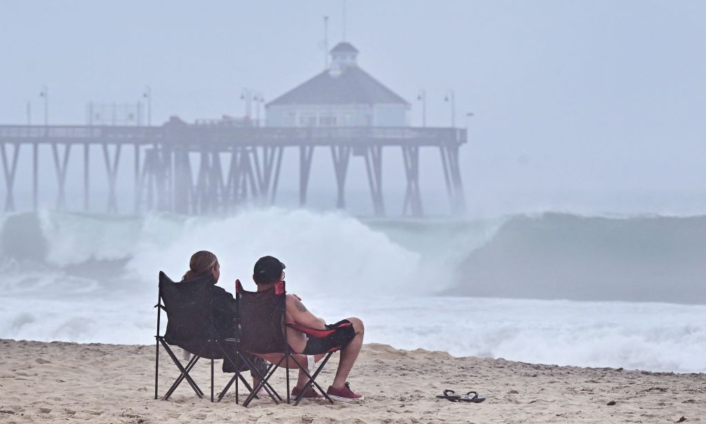 people sitting on chairs on beach