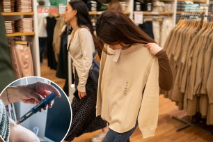 NEW YORK, NY - SEPTEMBER 22: People look at clothing displayed at a Uniqlo store September 22, 2023 in New York City. Uniqlo Company is a Japanese clothing designer, manufacturer and retailer.