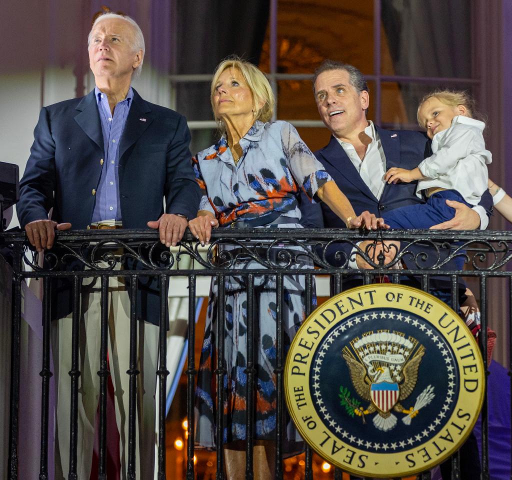 Joe and Jill Biden stand on the White House balcony with Hunter Biden holding his son Beau.