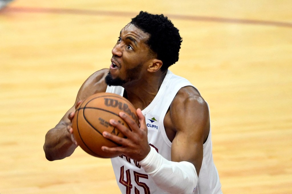 Cleveland Cavaliers guard Donovan Mitchell holding the basketball during the third quarter of the NBA playoffs game against Boston Celtics, May 11, 2024