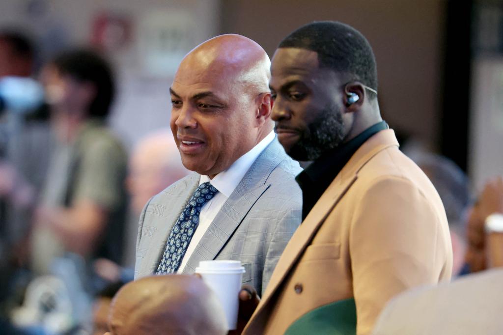 Charles Barkley (left) and Draymond Green (right) look on in the first half between the Dallas Mavericks and the Minnesota Timberwolves during game three of the western conference finals for the 2024 NBA playoffs at American Airlines Center.