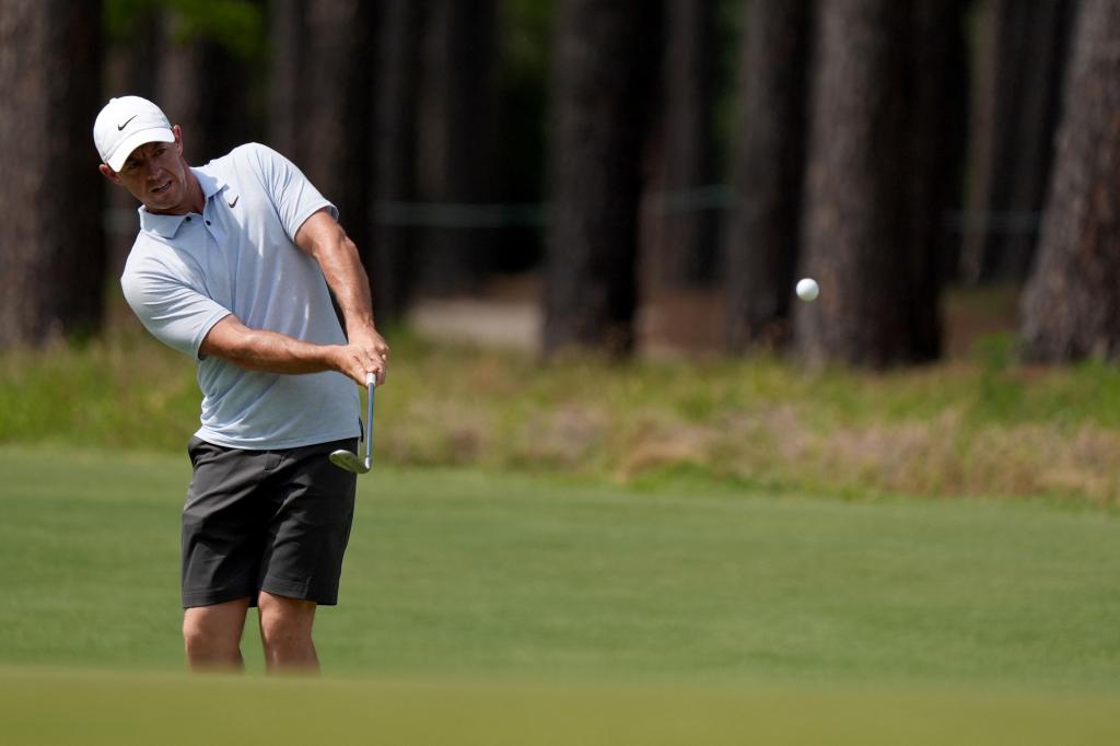 Rory McIlroy lchips up onto the 10th green during a practice round for the U.S. Open golf tournament at Pinehurst No. 2. 