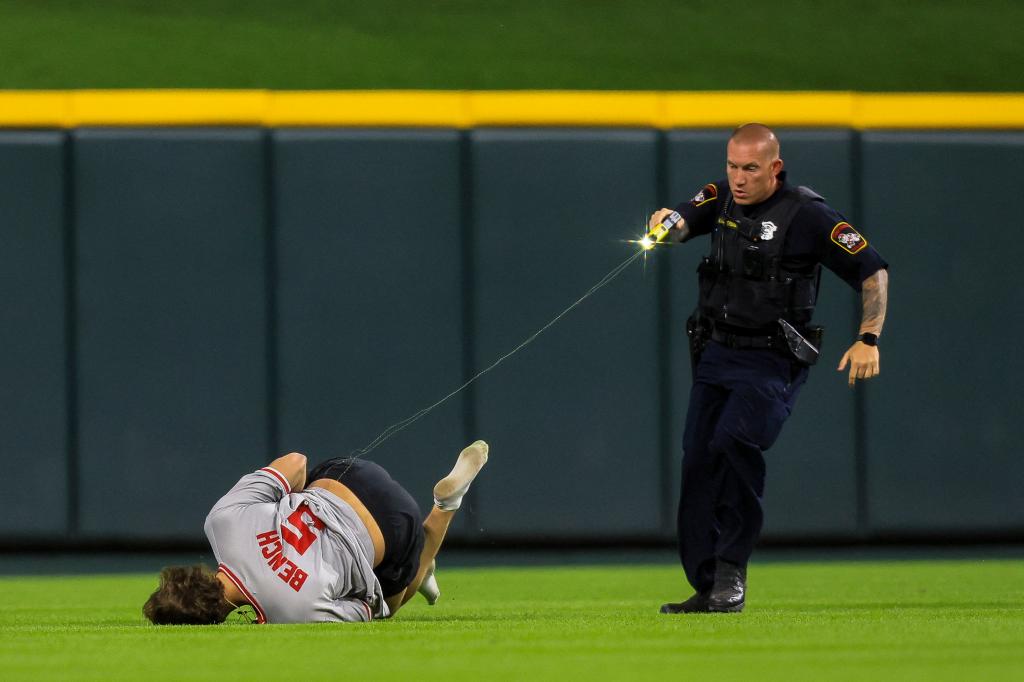 police officer tasing the fan