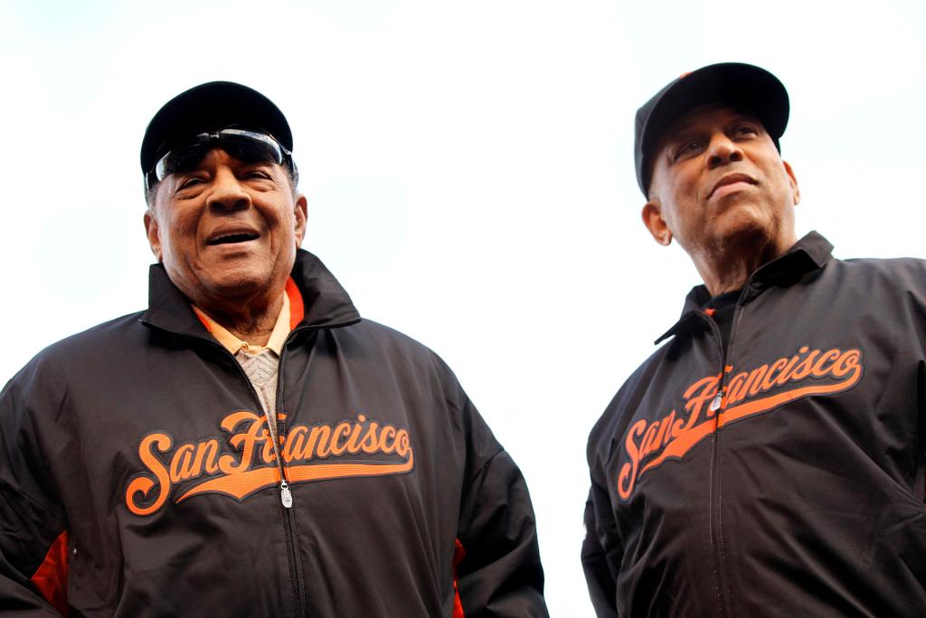 Hall of Famers Willie Mays (L) and Orlando Cepeda attend pre-game festivities ahead of the start of Game 1 of the MLB World Series baseball championship between the Detroit Tigers and the San Francisco Giants in San Francisco, October 24, 2012. 