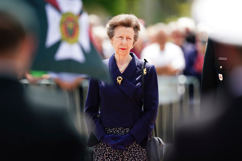 Britain's Princess Anne standing in front of a flag at a D-Day anniversary ceremony in Normandy, France