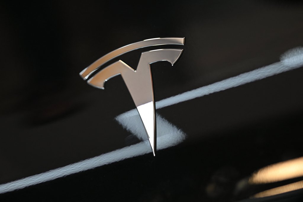 The well-known Tesla T symbol.