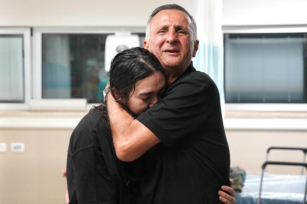 Argamani embraces her father, Yakov, at the Sheba Tel-Ha Shomer Medical Center in Ramat Gan on June 8, 2024.