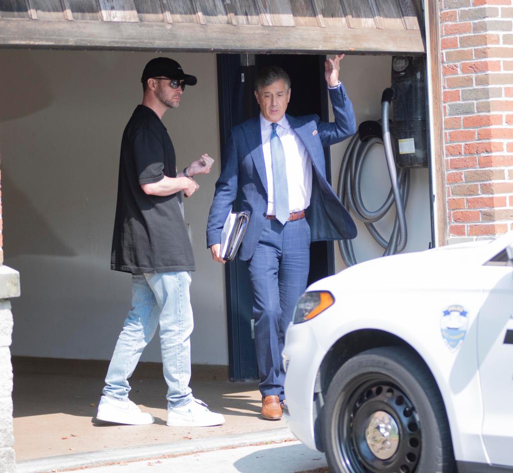 Justin Timberlake with his attorney Edward Burke Jr. exiting a courthouse after his arraignment for DWI charges, photographed by Doug Kuntz.