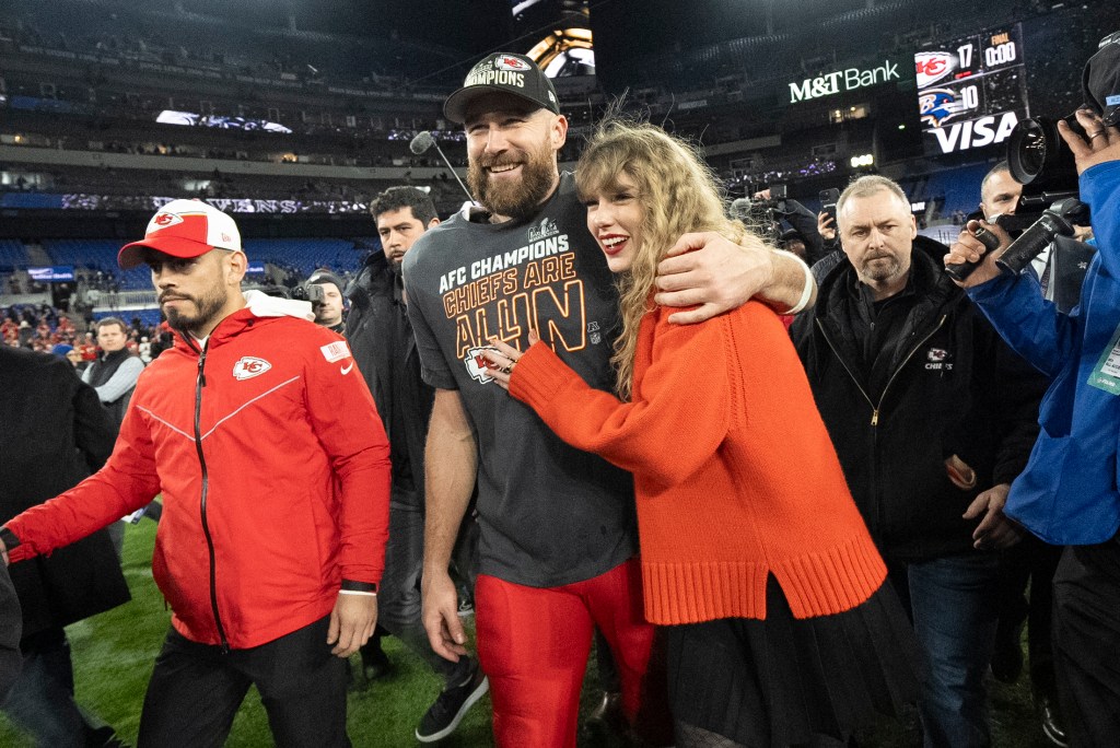 Kansas City Chiefs tight end Travis Kelce and Taylor Swift walk together after an AFC Championship NFL football game between the Chiefs and the Baltimore Ravens, Jan. 28, 2024, in Baltimore.. 