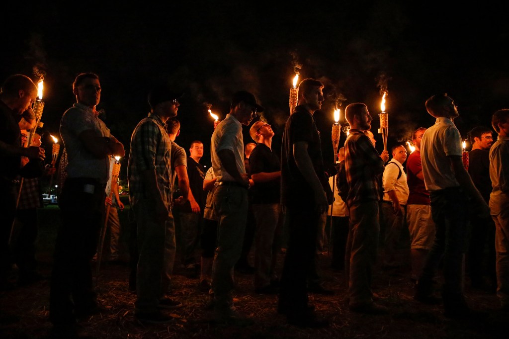 White nationalist groups marched with torches through the University of Virginia campus on Aug. 11, 2017, in Charlottesville, Va.