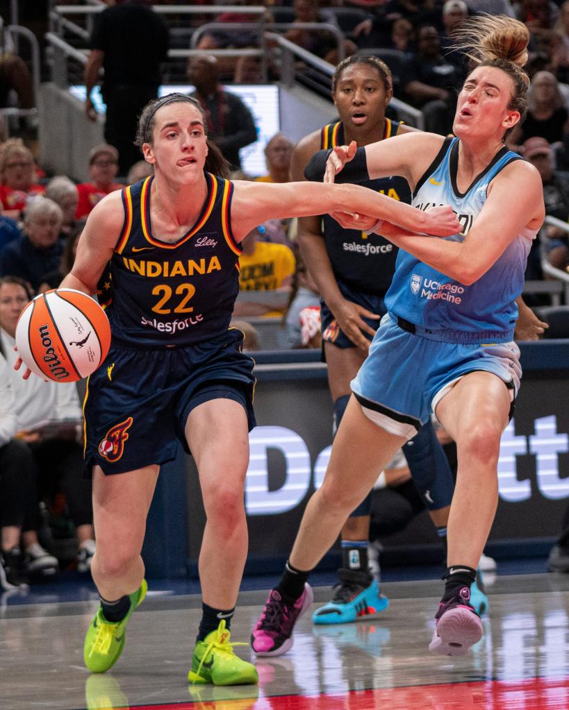 Caitlin Clark (22) dribbles during the Fever's win over the Sky on Sunday.