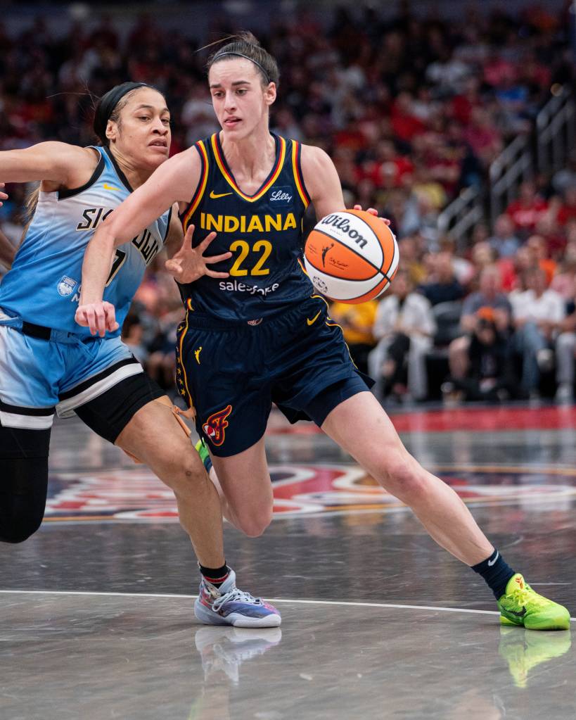 Indiana Fever guard Caitlin Clark (22) dribbles around Chicago Sky guard Chennedy Carter (7) on Sunday June 16, 2024, during the game at Gainbridge Fieldhouse in Indianapolis on June 16, 2024.
