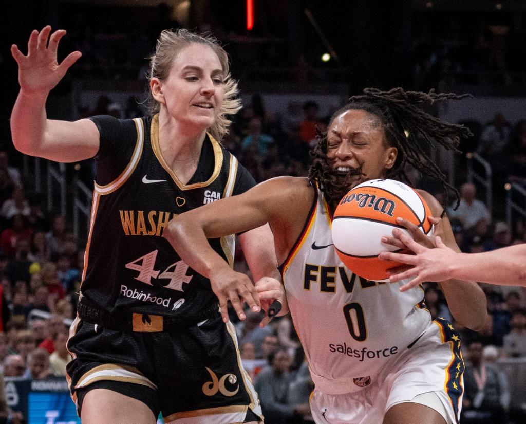 Indiana Fever guard Kelsey Mitchell (0) rushes up the court against Washington Mystics guard Karlie Samuelson