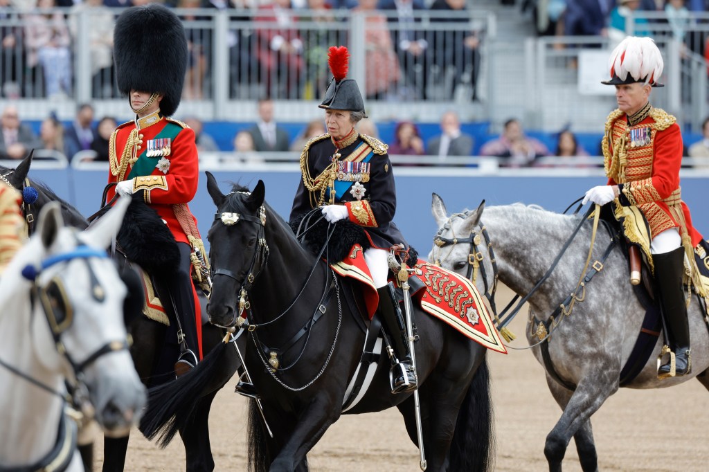 Princess Anne, Princess Royal, participating in the Trooping the Colour ceremony with soldiers and musicians on horseback at Horse Guards Parade in London, England, 2024.