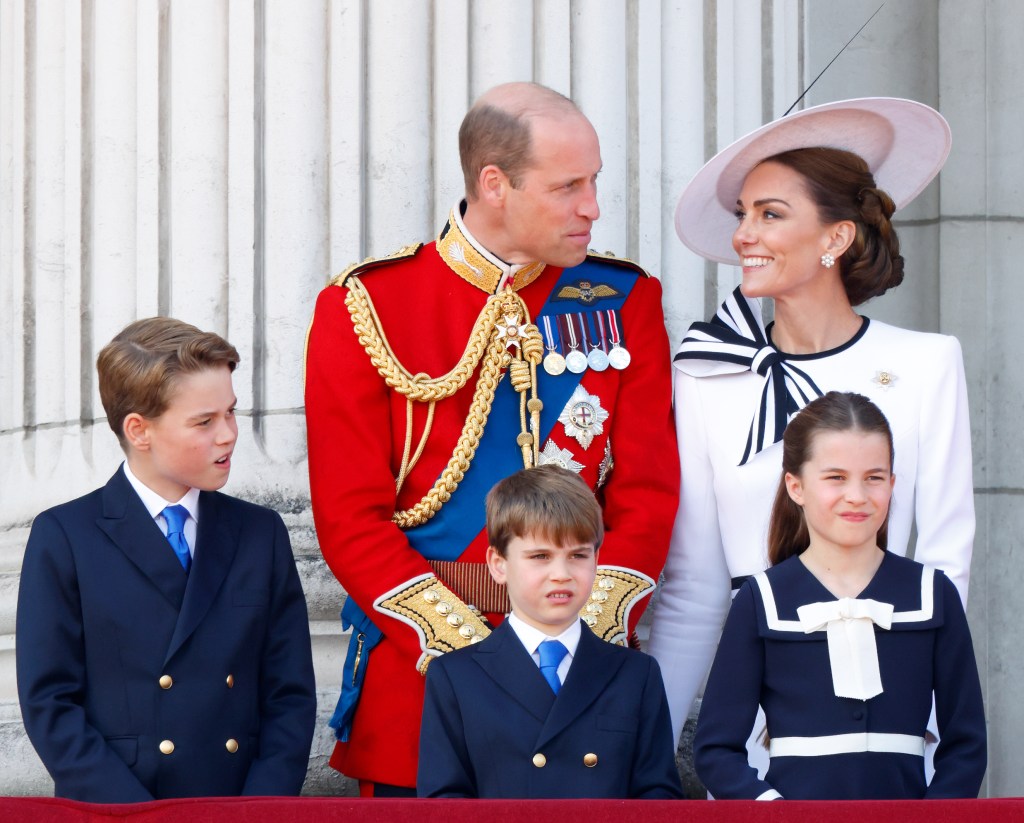 Prince William, Prince George, Prince Louis, Princess Charlotte, and Catherine, Princess of Wales watching an RAF flypast from the balcony of Buckingham Palace during the Trooping the Colour ceremony, 2024.