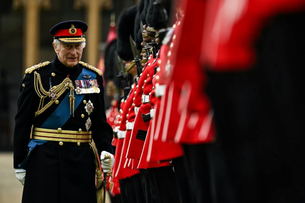 King Charles III reviewing the Irish Guards and presenting new colours during a ceremony at Windsor Castle on June 10, 2024