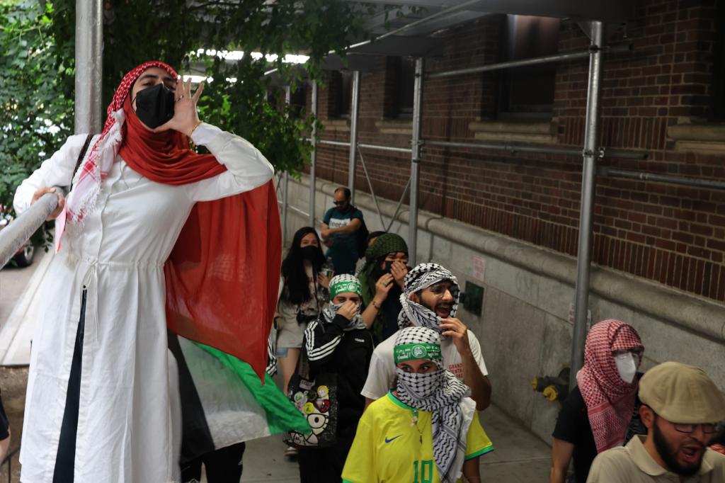 Pro-Palestine protestors march after a rally against the Baruch College Hillel campus organization