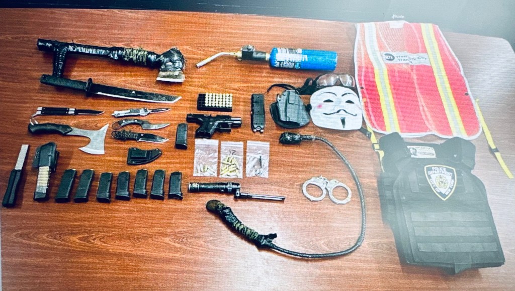 Police discovered items including a gun, loaded magazines, body armor and knives inside Sanson's car.