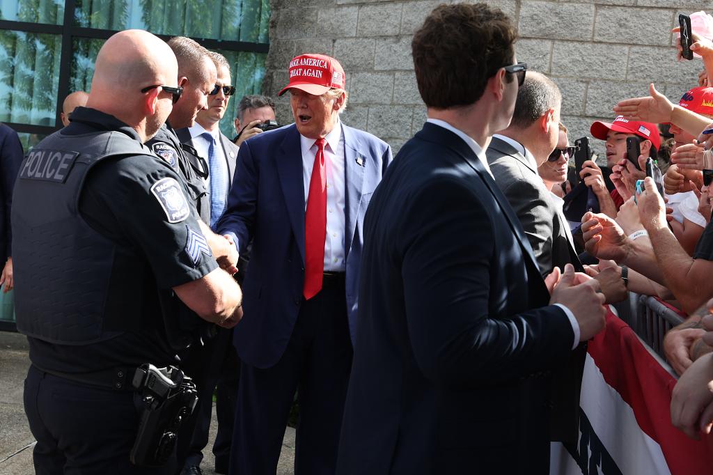 Trump speaking with security