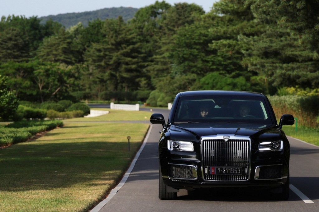 The pair drove around a manicured motor park, and at one point switched seats during the ride