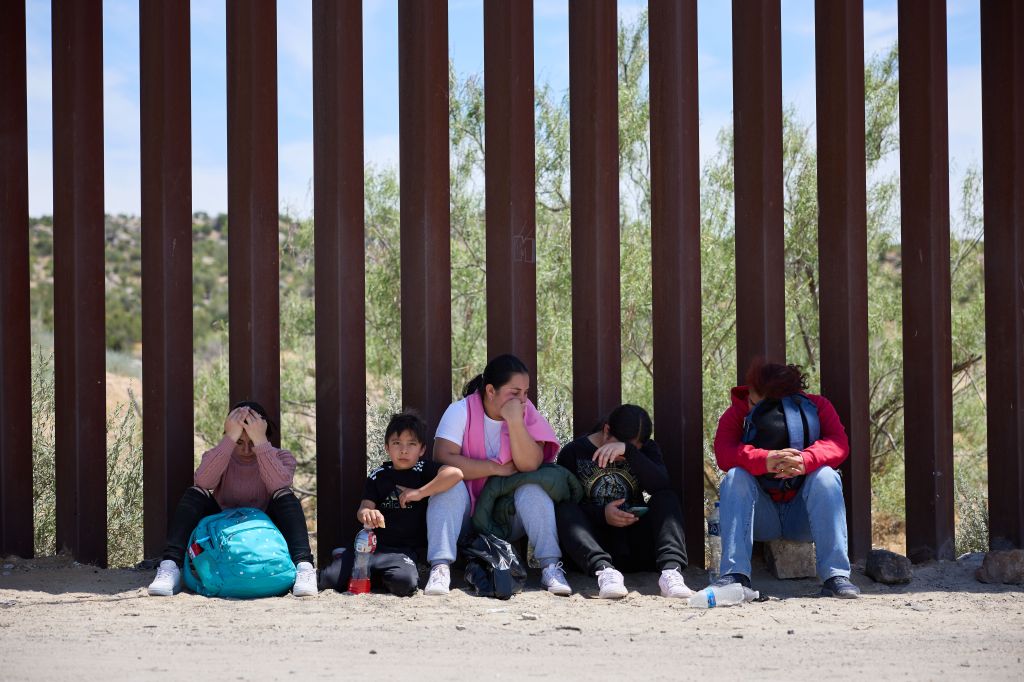 Group of migrants waiting at the US-Mexico border in Jacumba, California after new asylum restrictions enforced, June 2024