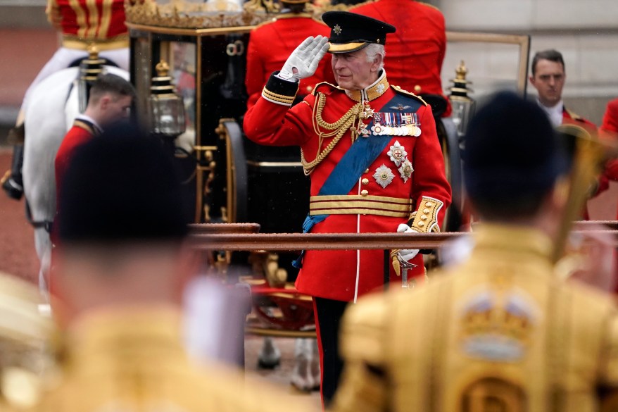 Britain's King Charles III takes a salute.