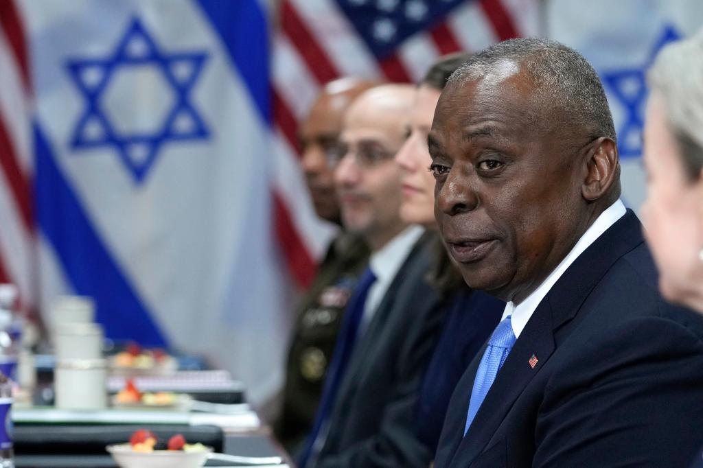 US Defense Secretary Lloyd Austin , seated next to Israeli representatives during a meeting at the White House Tuesday.