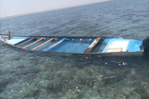 A capsized boat is seen near the coastal town of Obock, in northeastern Djibouti Tuesday, April 9, 2024. 