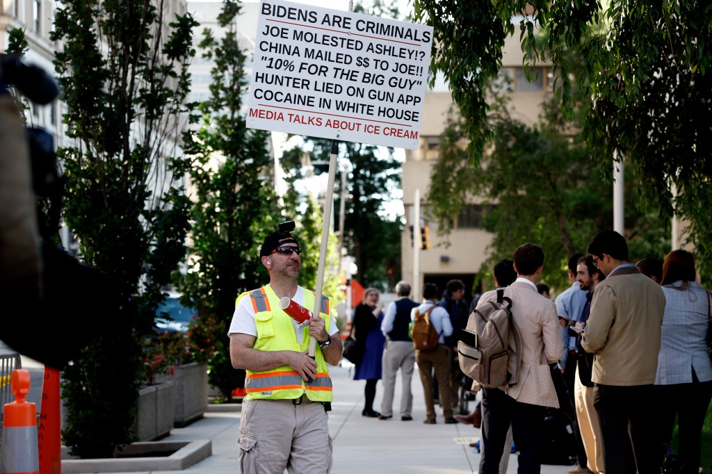 A protester stands outside of the J. Caleb Boggs Federal Building on June 11, 2024 in Wilmington, Delaware.