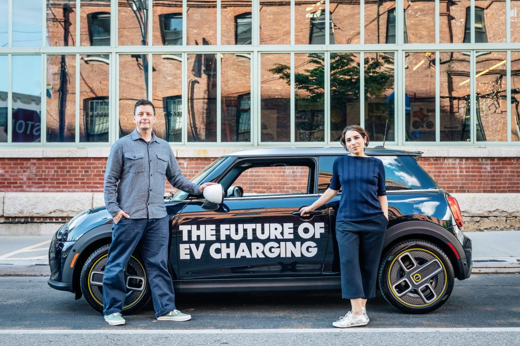 Newlab founders, Tiya Gordon and Nathan, standing next to an EV car in Brooklyn on May 29, 2024.