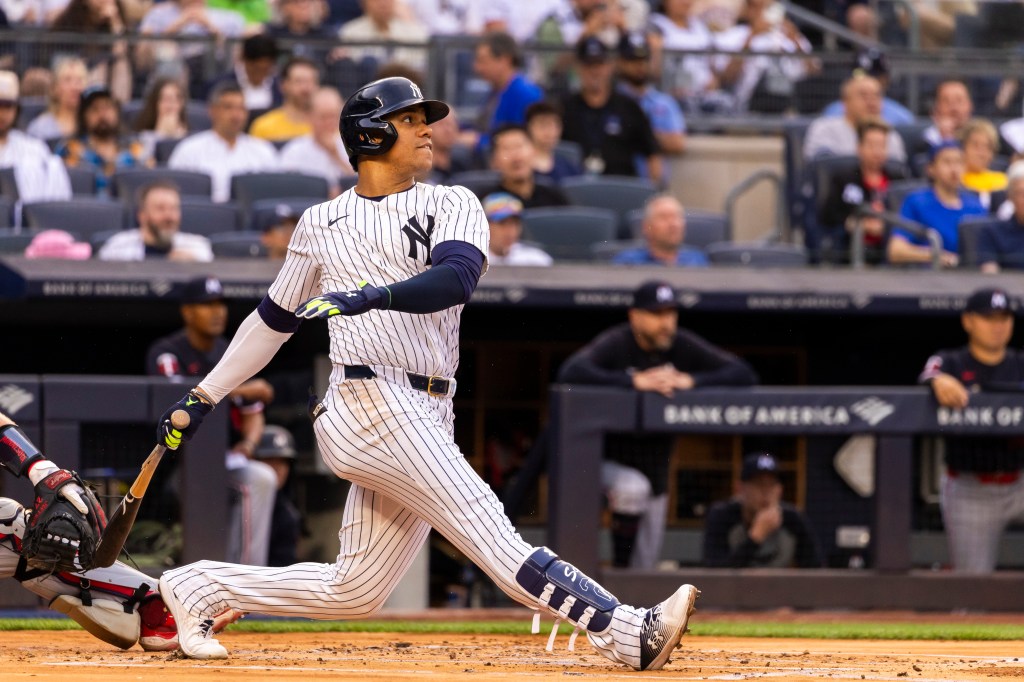 New York Yankees outfielder Juan Soto (22) hits a single during the first inning against the Minnesota Twins at Yankee Stadium Wednesday, June 5, 2024,