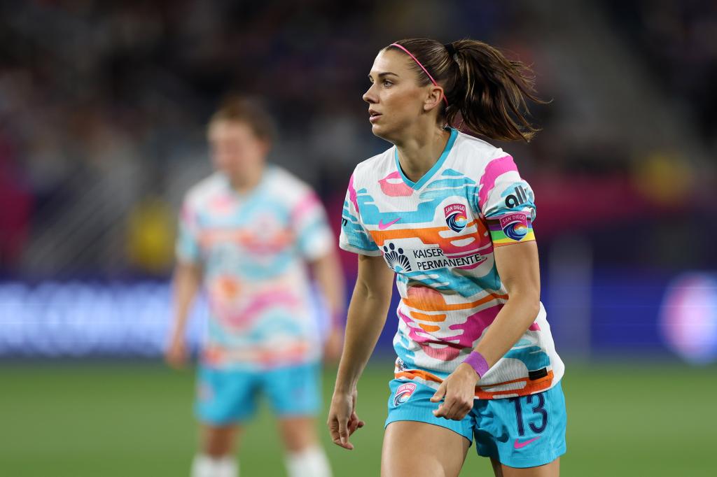 Alex Morgan, wearing number 13, playing forward for San Diego Wave FC during a game against Orlando Pride at Snapdragon Stadium
