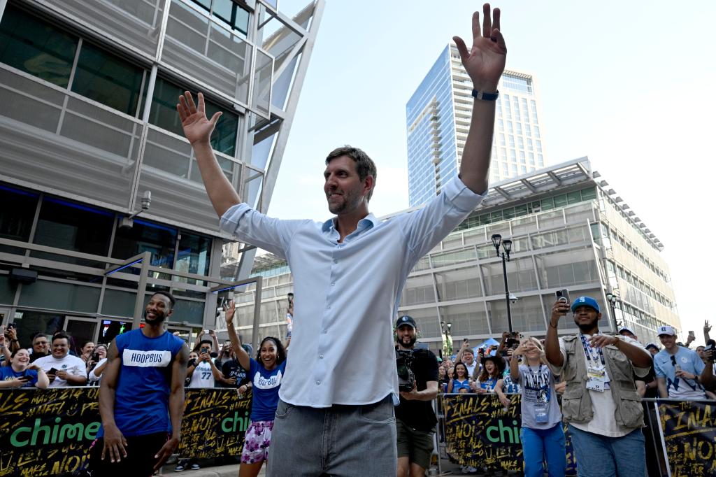Former NBA player Dirk Nowitzki with his hands up in the air before game three of the 2024 NBA Finals between the Boston Celtics and Dallas Mavericks at American Airlines Center