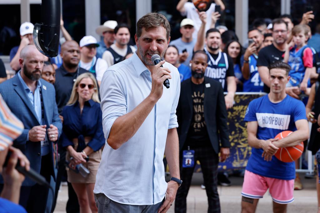 Dirk Nowitzki holding a microphone before game three of the 2024 NBA Finals between the Boston Celtics and Dallas Mavericks at American Airlines Center
