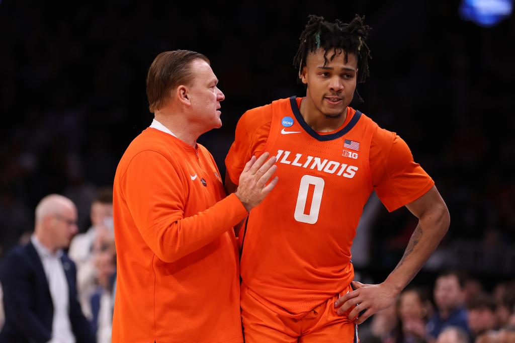 Head coach Brad Underwood of the Illinois Fighting Illini hugging Terrence Shannon Jr. during a game against the Connecticut Huskies in the NCAA Men's Basketball Tournament