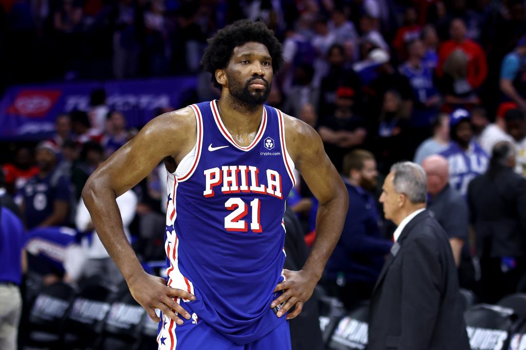 Joel Embiid, a basketball player for the Philadelphia 76ers, reacting with hands on hips after his team's loss to the New York Knicks in game six of the Eastern Conference First Round Playoffs