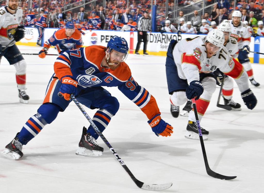 Connor McDavid #97 of the Edmonton Oilers skates against Niko Mikkola #77 of the Florida Panthers in Game 3 of the 2024 Stanley Cup Final.