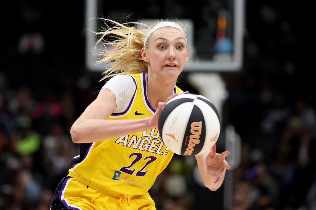 Cameron Brink #22 of the Los Angeles Sparks passes during the third quarter against the Seattle Storm at Climate Pledge Arena on June 11, 2024 in Seattle, Washington