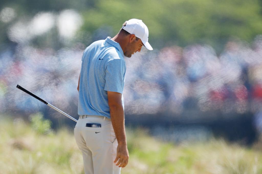 Scottie Scheffler of the United States reacts to his second shot on the fourth hole during the third round of the 124th U.S. Open