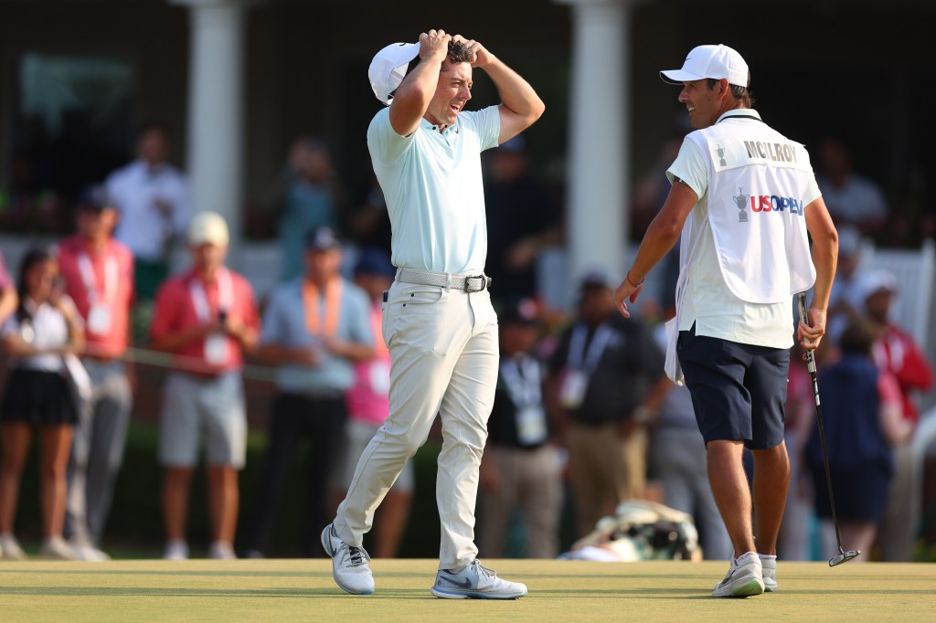 Rory McIlroy of Northern Ireland talks with his caddie Harry Diamond after making a bogey on the 18th hole during the final round of the 124th U.S. Open at Pinehurst Resort on June 16, 2024 in Pinehurst, North Carolina. 